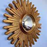 Old large golden sun mirror with rounded witch's eye in vintage resin from the 70s