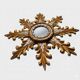 "Witch mirror 'Sun' in gilded wood with acanthus leaf decoration"