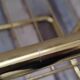 Pair of vintage smoked glass and brass bedside tables