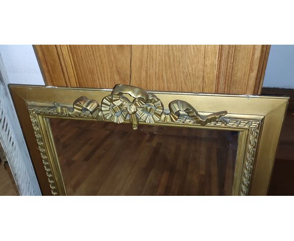 Miroir doré décor noeud 76x102cm