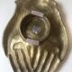 empty pocket or old patinated bronze ashtray, e, hand shape. Good condition.