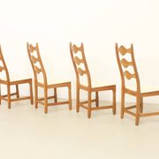 Four oak dining chairs by Henning Kjaernulf.