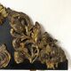 Pediment in blackened wood and 19th century embossed gilded metal foil