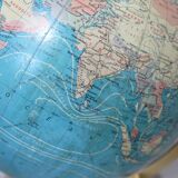 Luminous world map in tripod glass