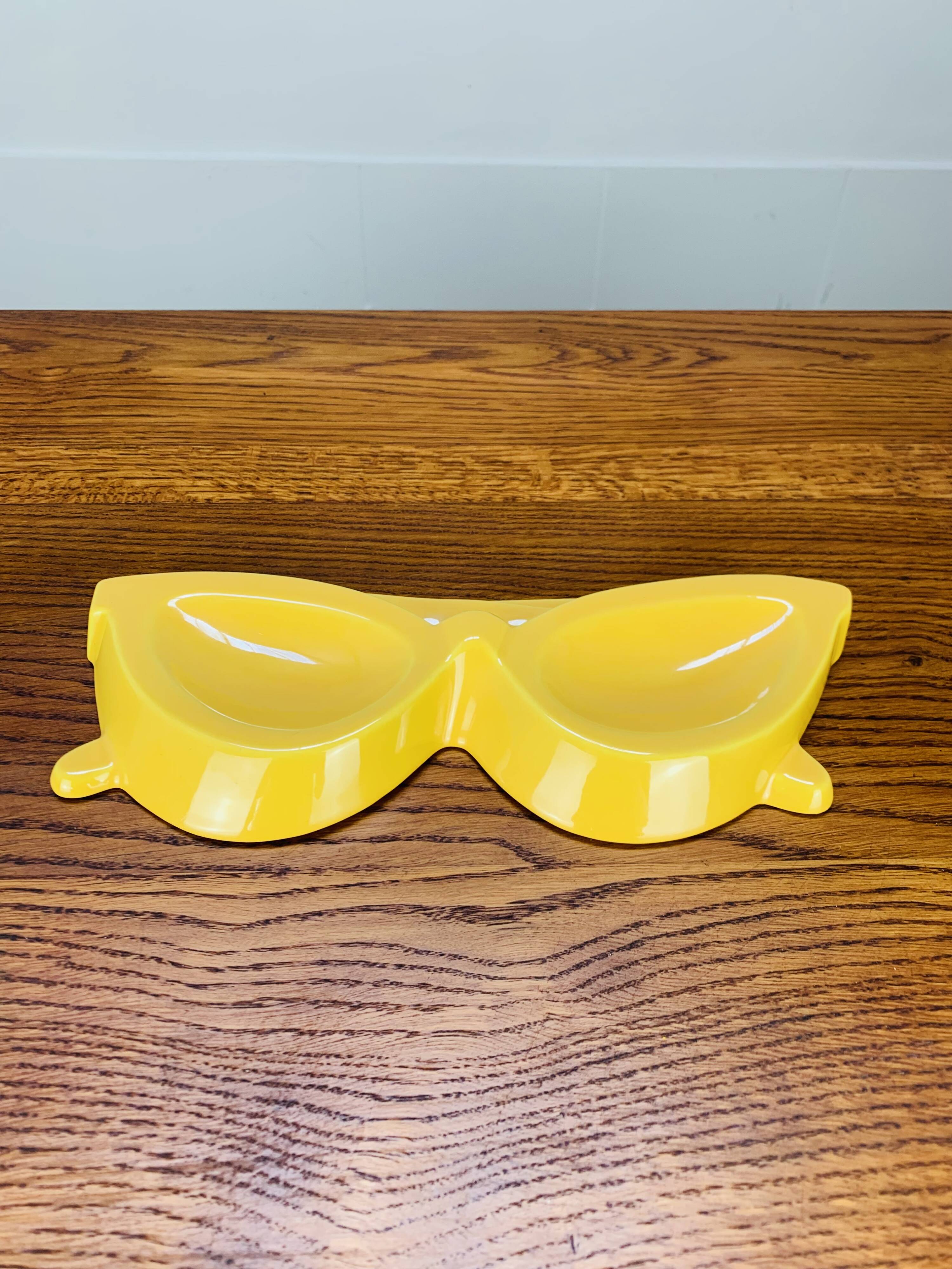 Vintage yellow ceramic glasses emptier