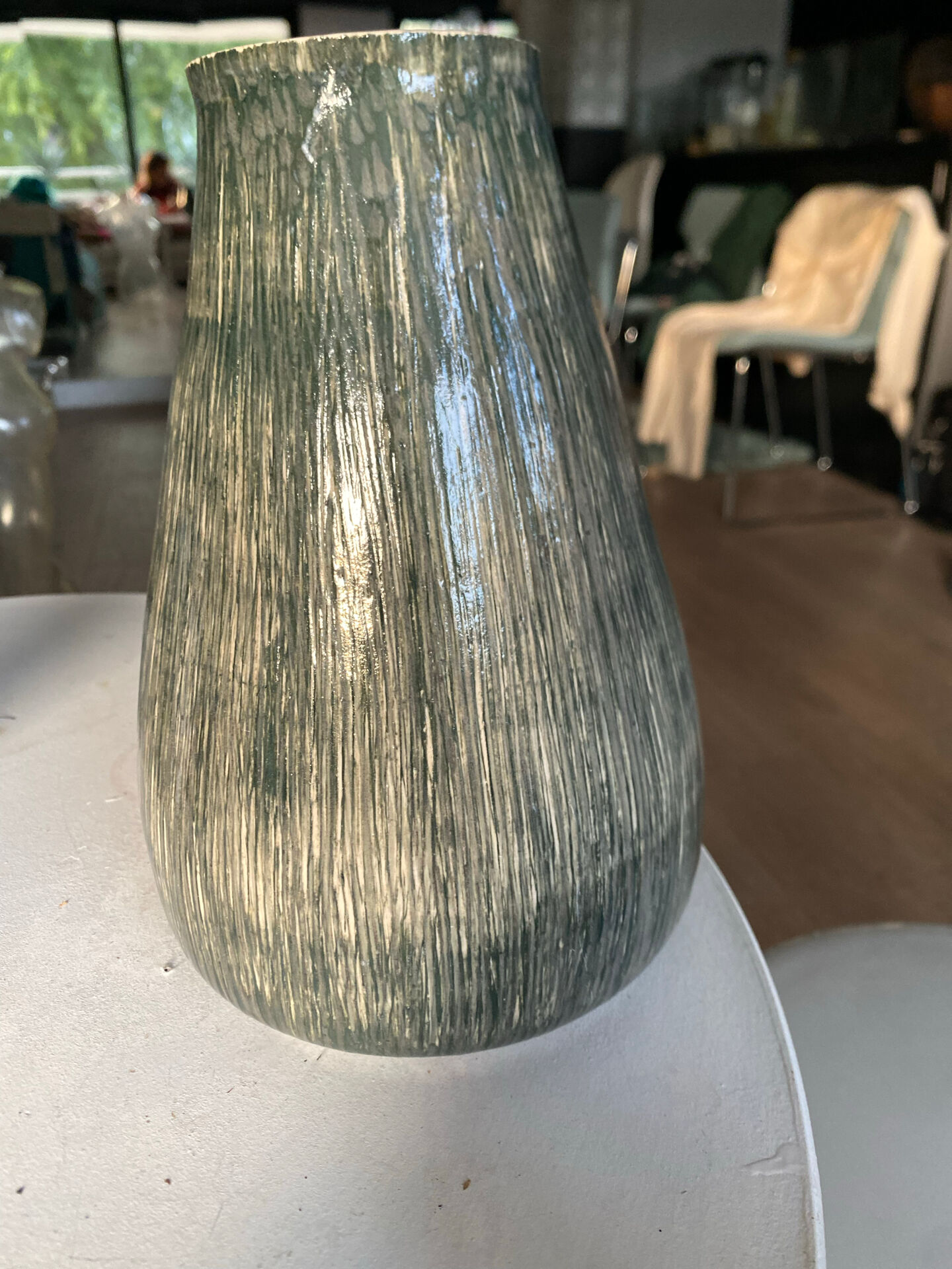 New green ceramic artisanal vase.