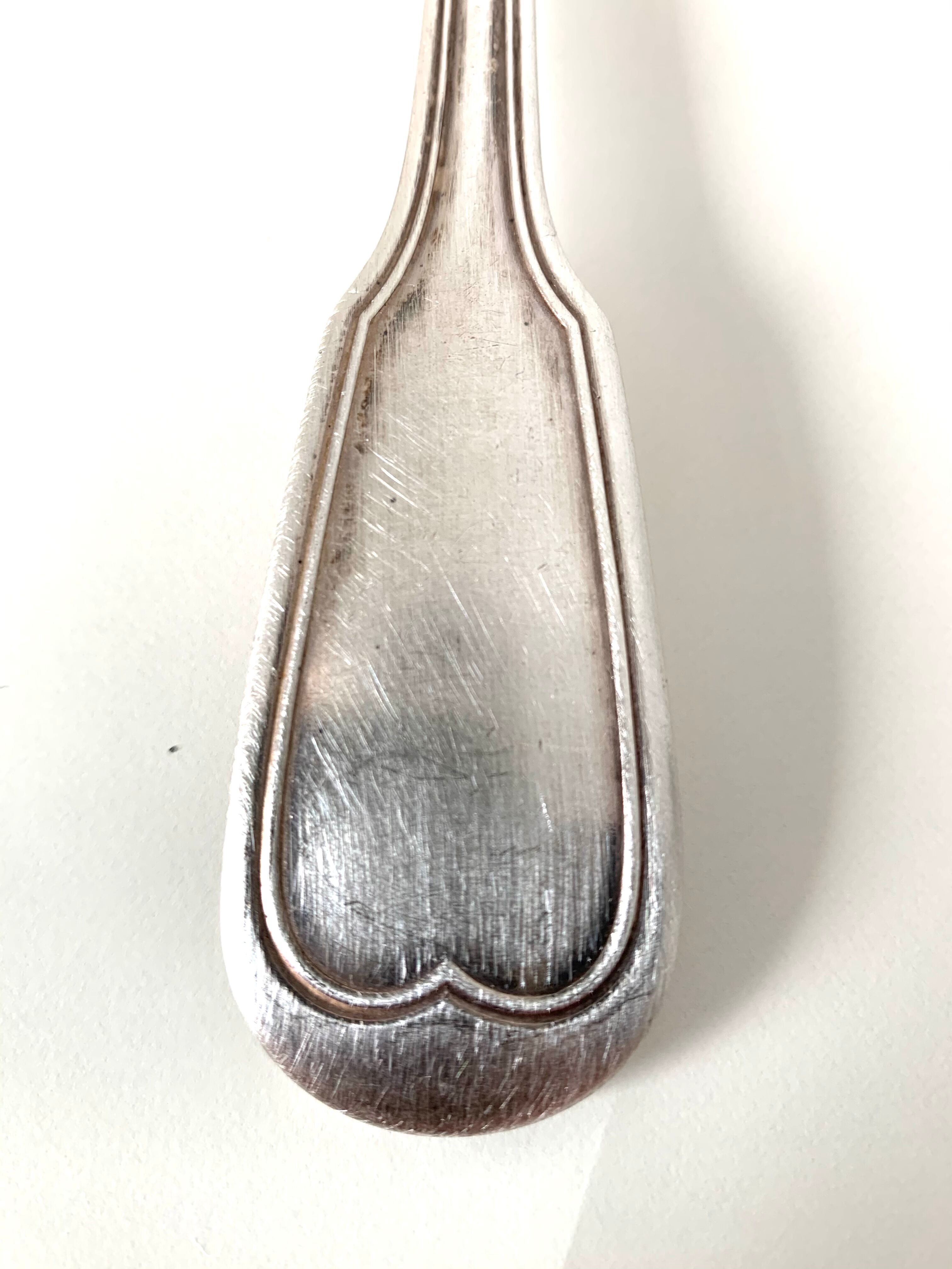 10 silver metal spoons
