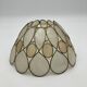 Mother-of-pearl and brass suspension