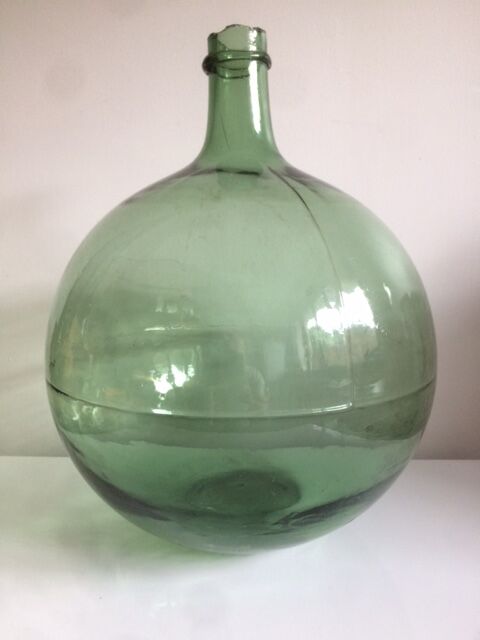 Demijohn old transparent green, estimated capacity around 12 to 15L