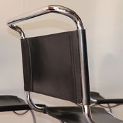 Series of 6 minimalist chairs in chrome metal and black leather around 1970