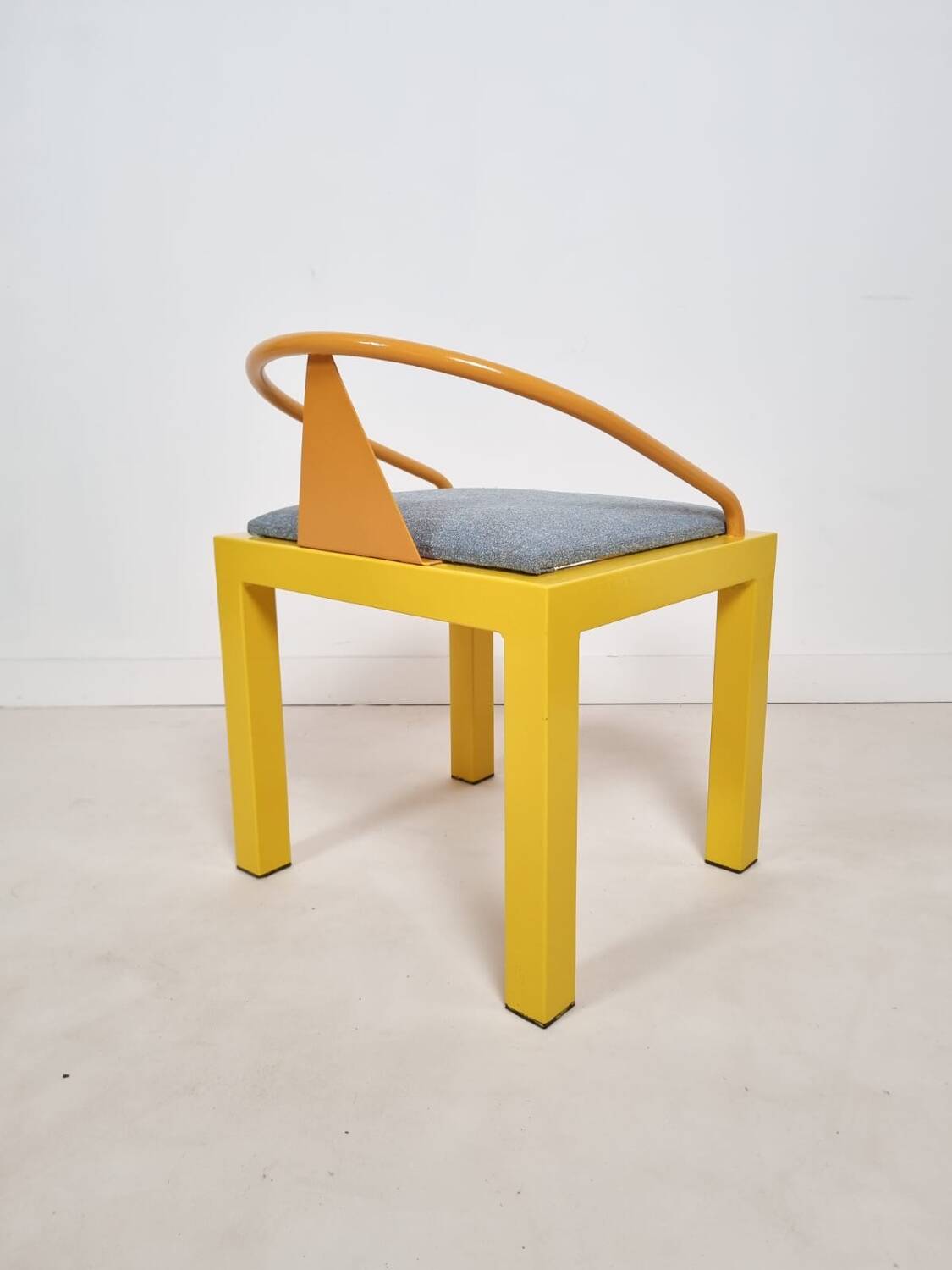 Memphis style chair in the style of Michele De Luchini