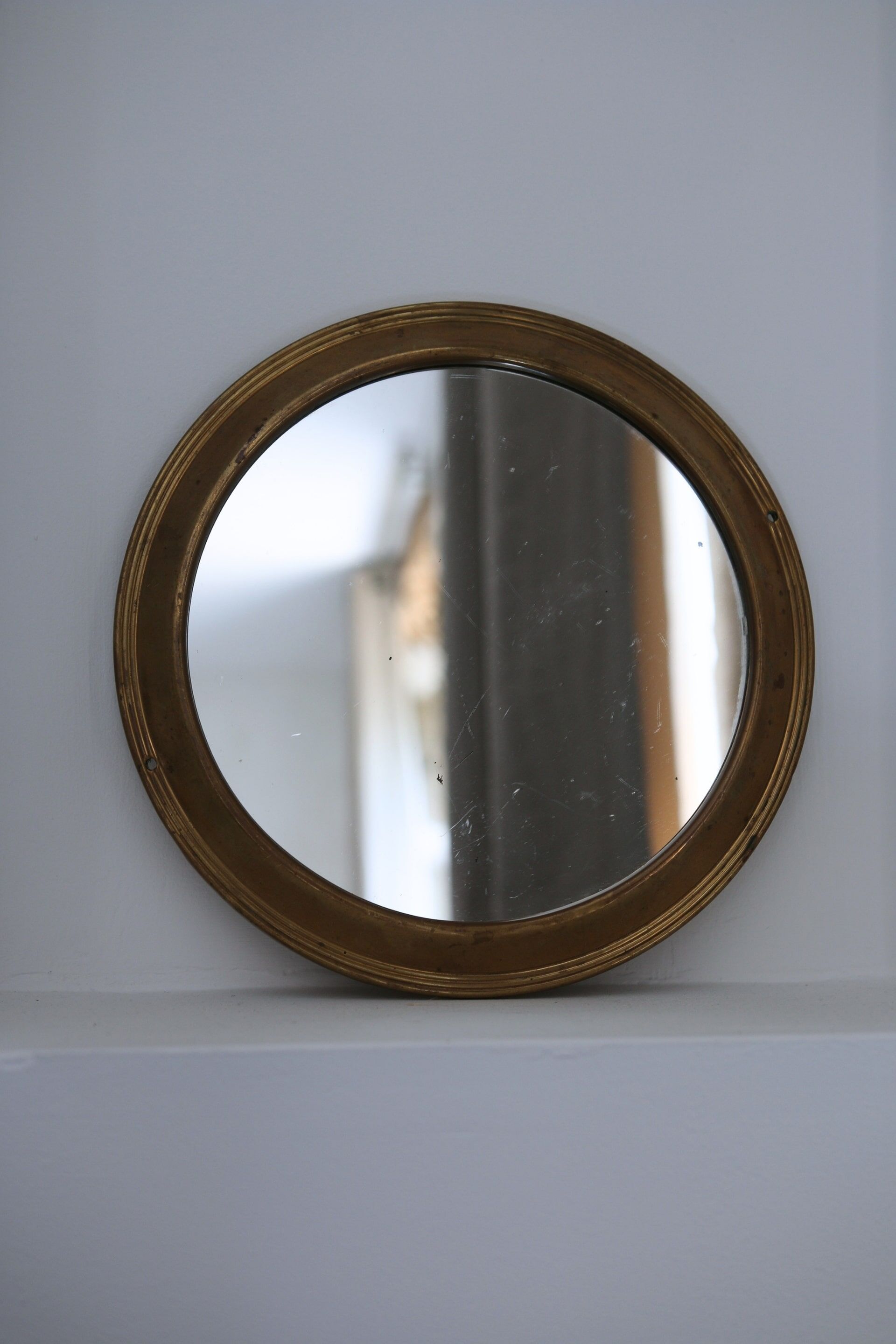 Antique round brass mirror