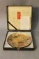 Japanese dish in gold brocade