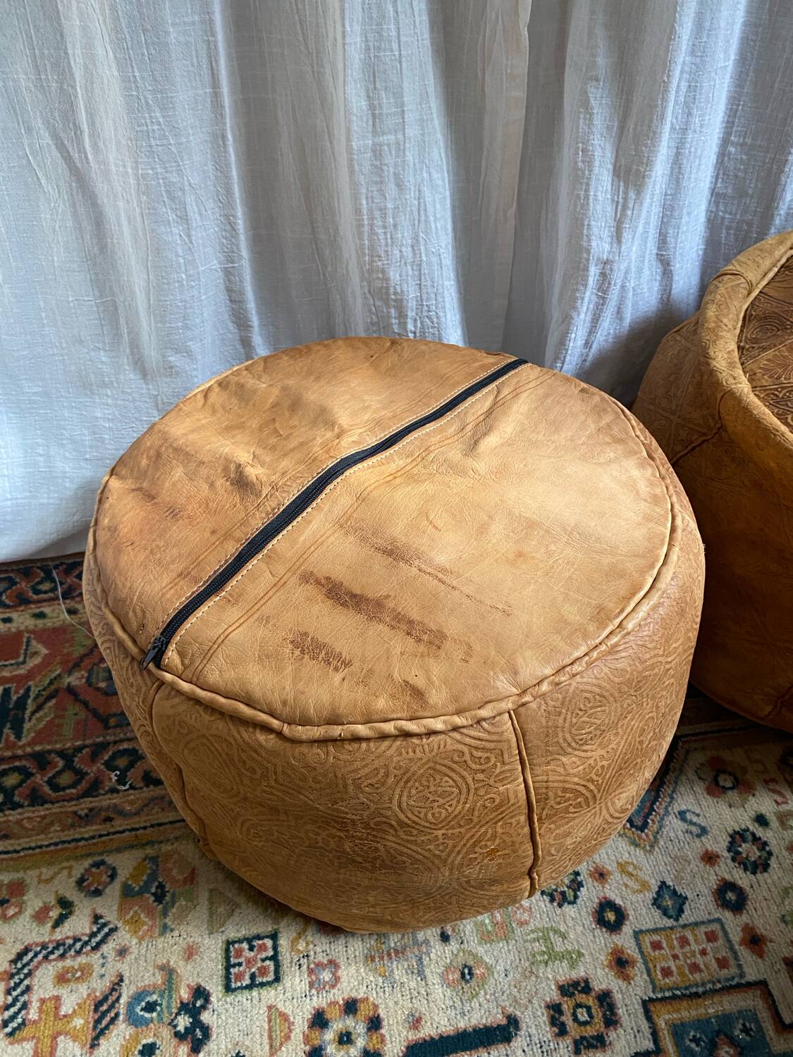 Pair of leather poufs