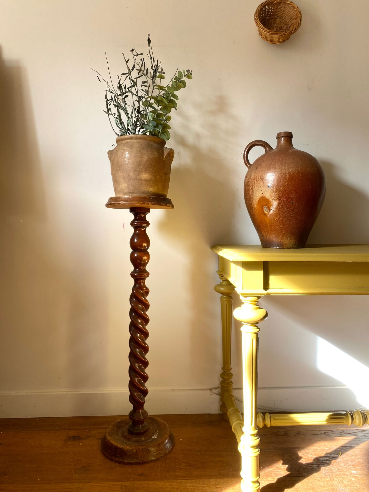 Antique pedestal table with a twisted column.