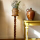 Antique pedestal table with a twisted column.