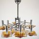 12-light Mazzega chandelier in amber and clear murano glass and chrome. Ita