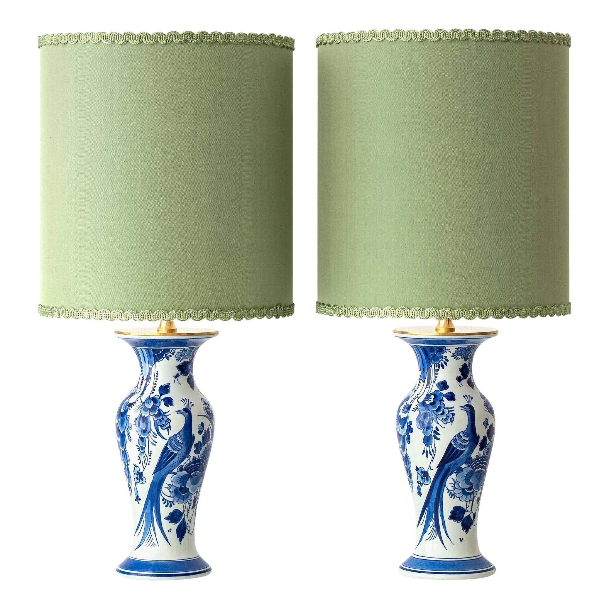 Pair of Chinese table lamps in Delft blue ceramic with new green silk shades.