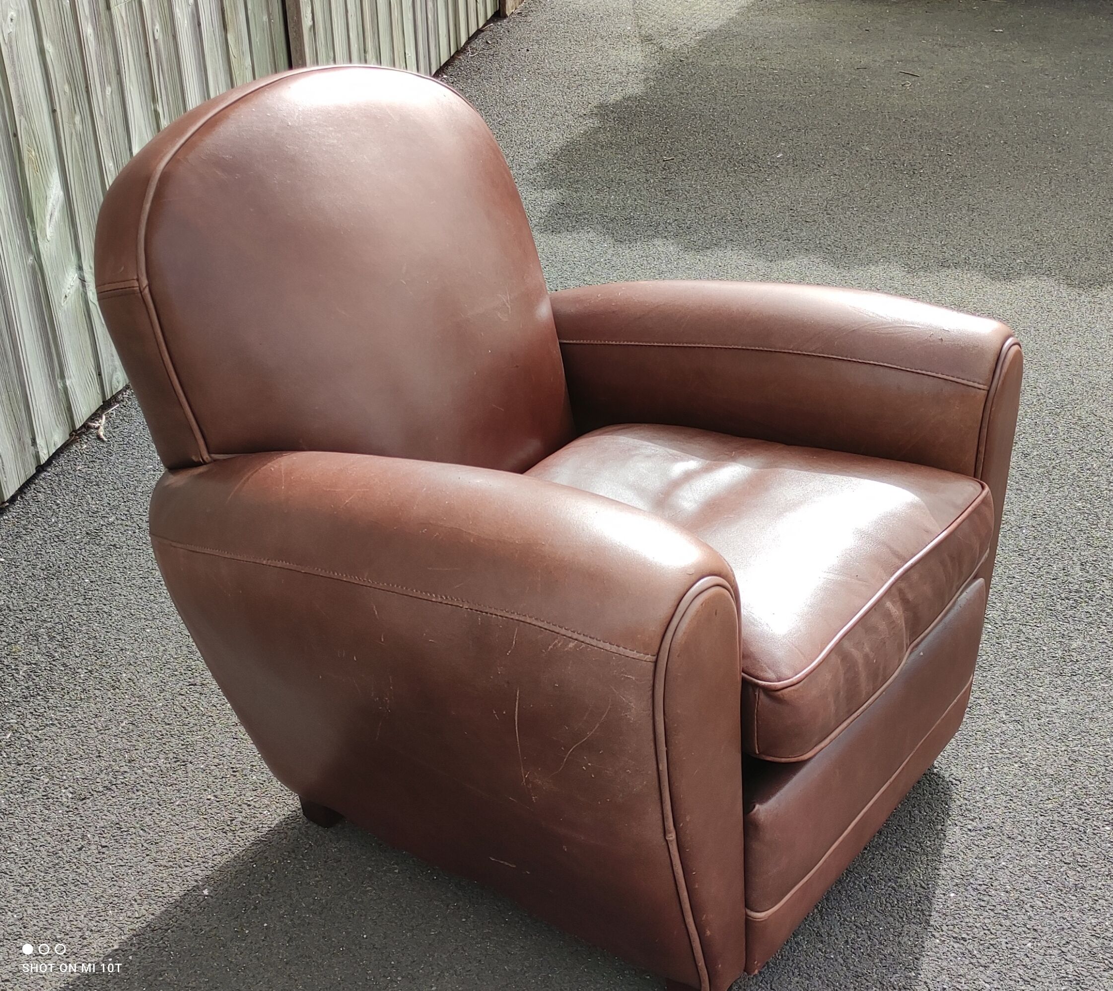 Club chair in brown leather