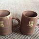 Series of 2 sandstone mugs