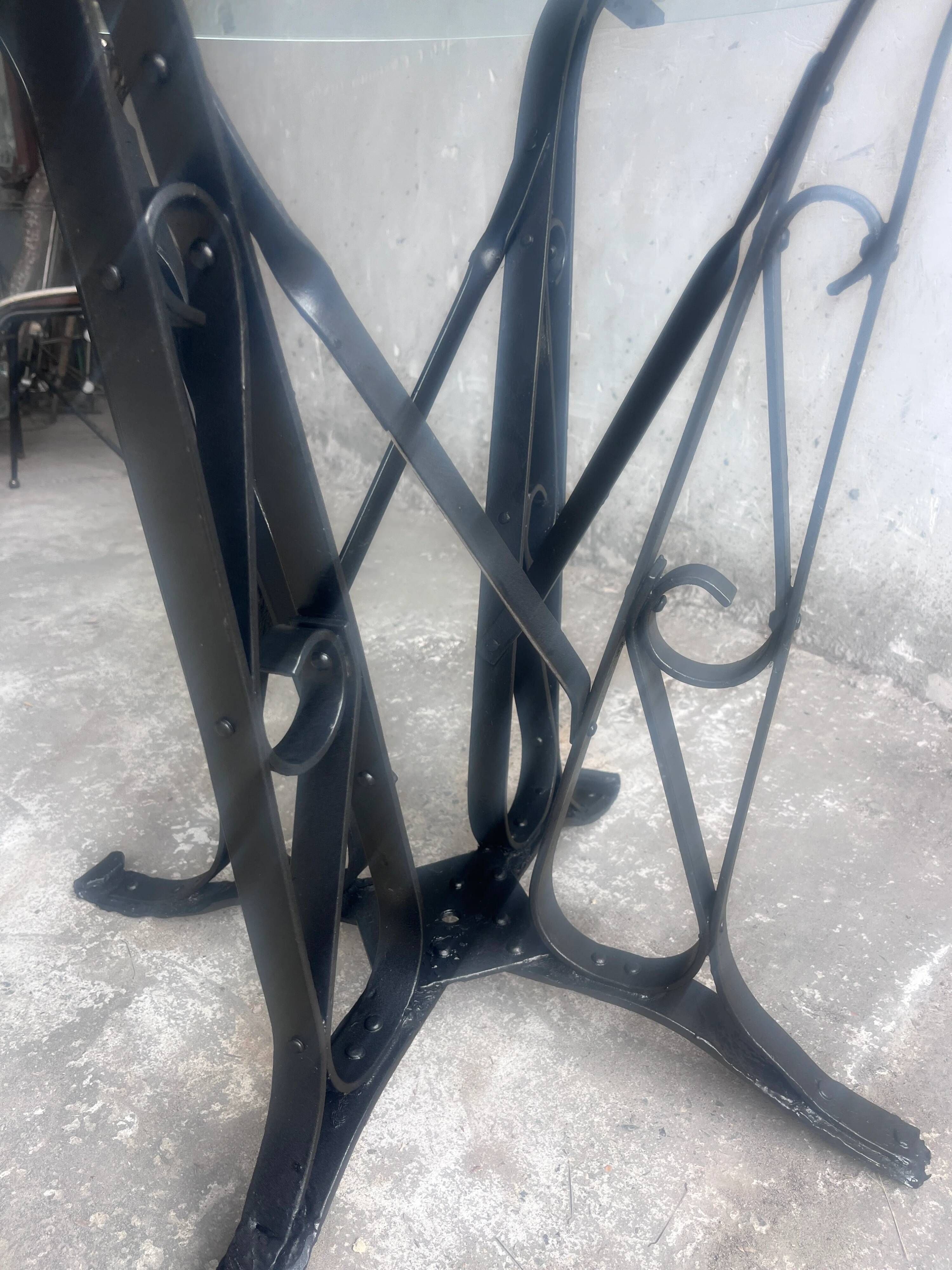 French Art Deco dining table in wrought iron and glass, circa 1930.