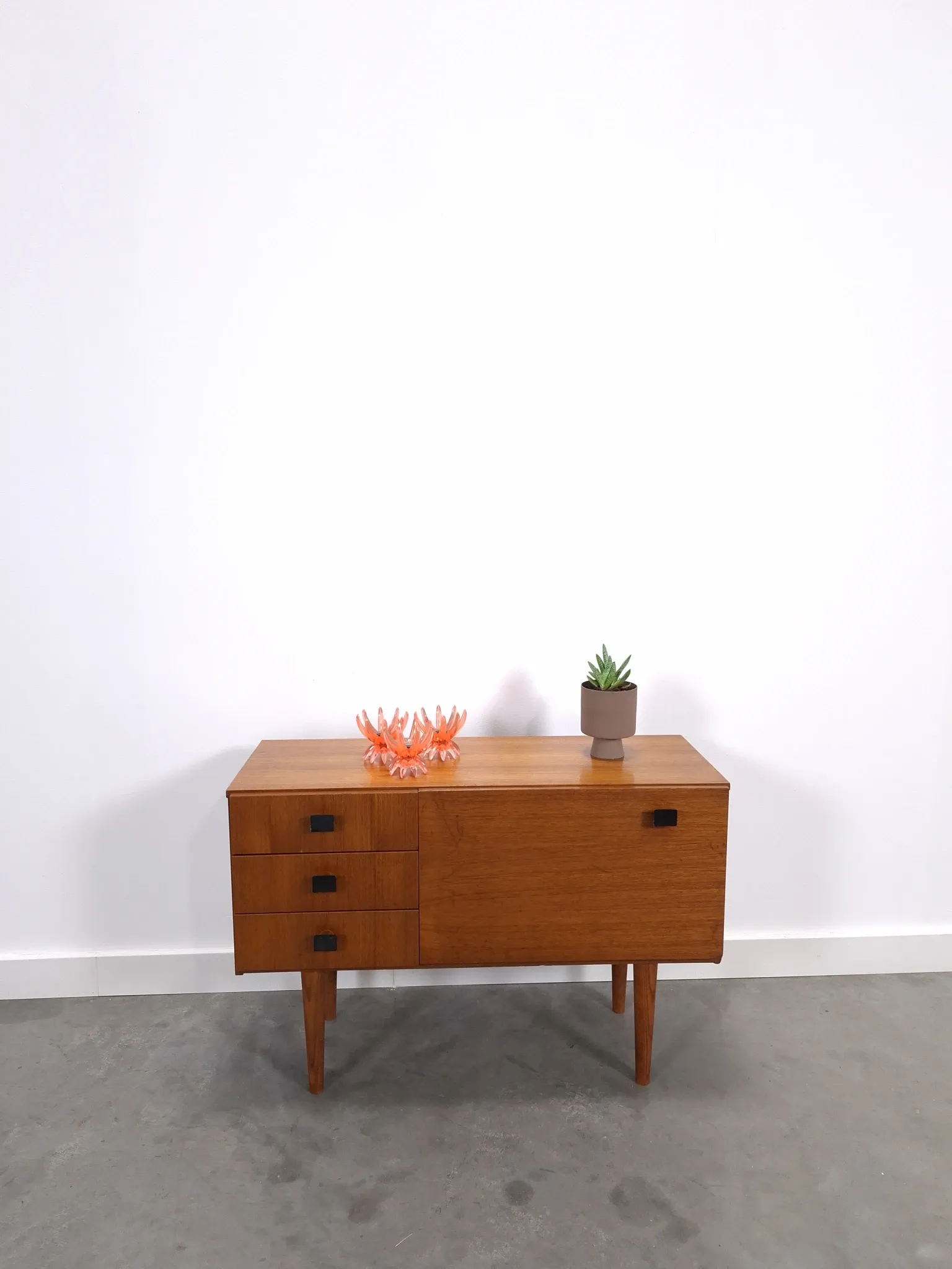 Vintage small teak cabinet with drawers, flap and black handles, hallway cabinet.