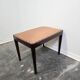 Vintage wooden ottoman from the 1940s with a silk top and studded trim.