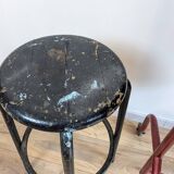Old black industrial stool