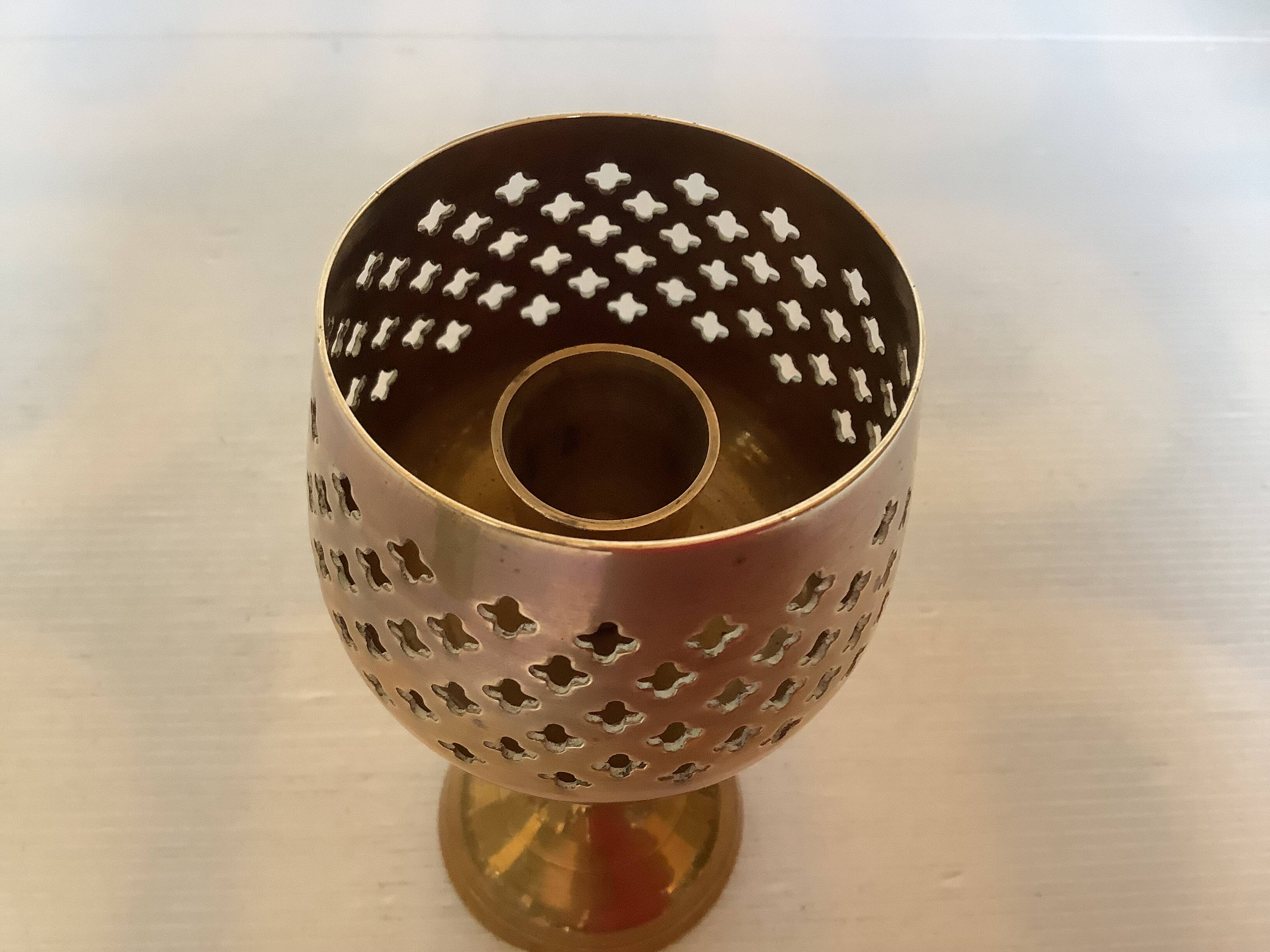 Lattice brass catchall and candlestick.