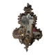 Mirror with a decorative frame featuring a four-light wall sconce, 19th century.