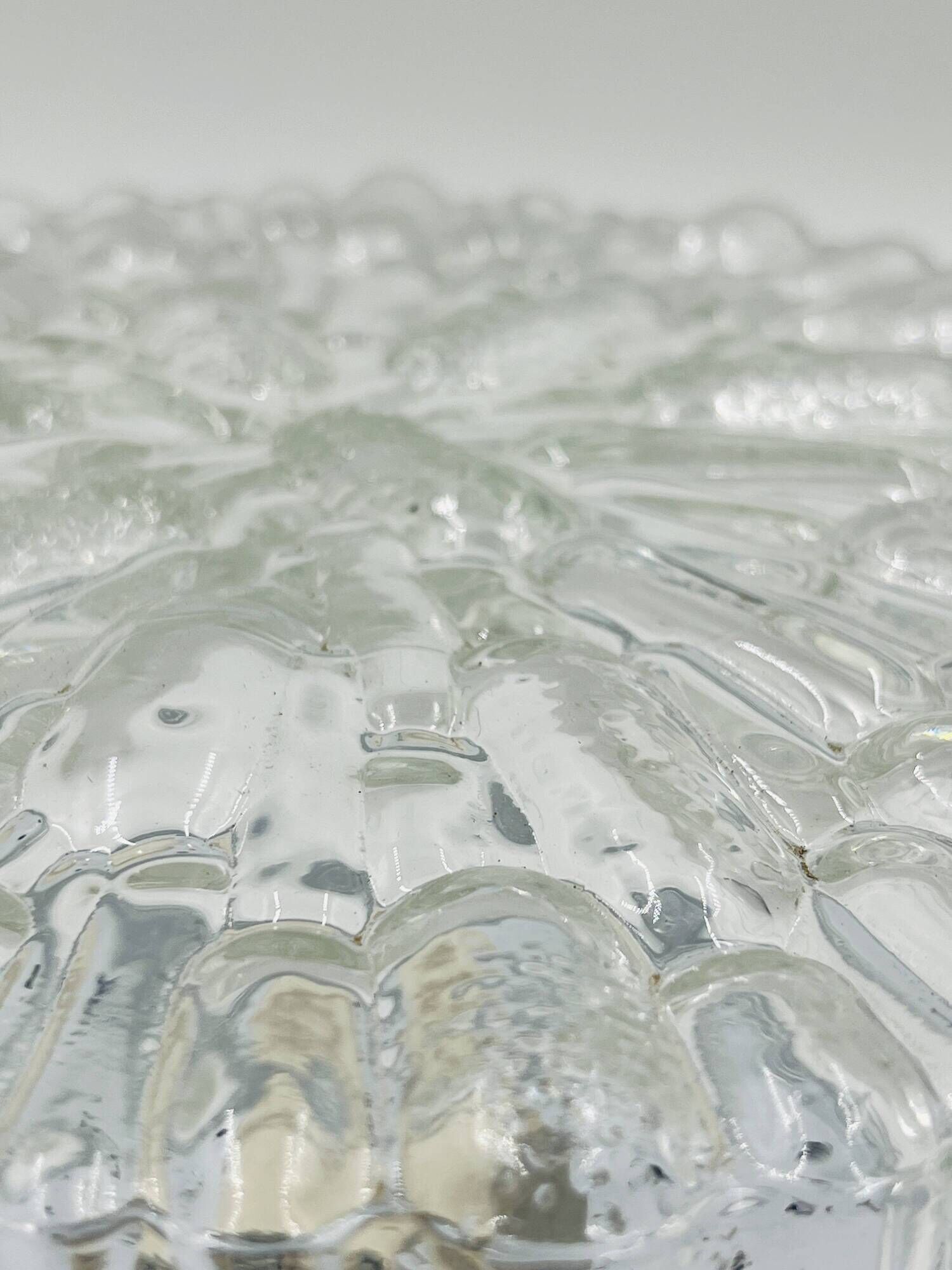 Massive modernist ceiling light in moulded glass