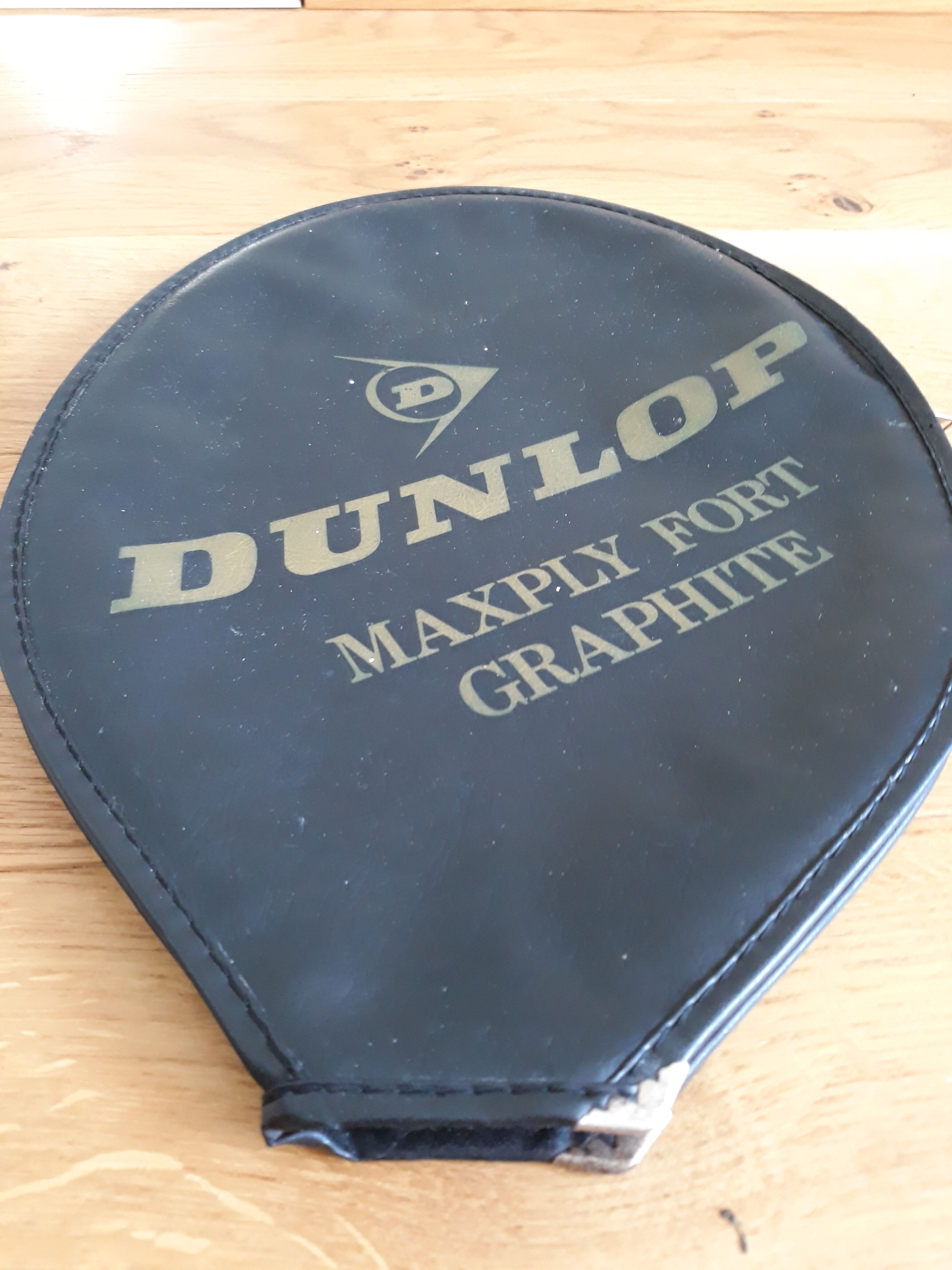 Wooden Dunlop tennis racket with its cover