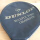 Wooden Dunlop tennis racket with its cover