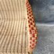 Vintage braided rattan armchair