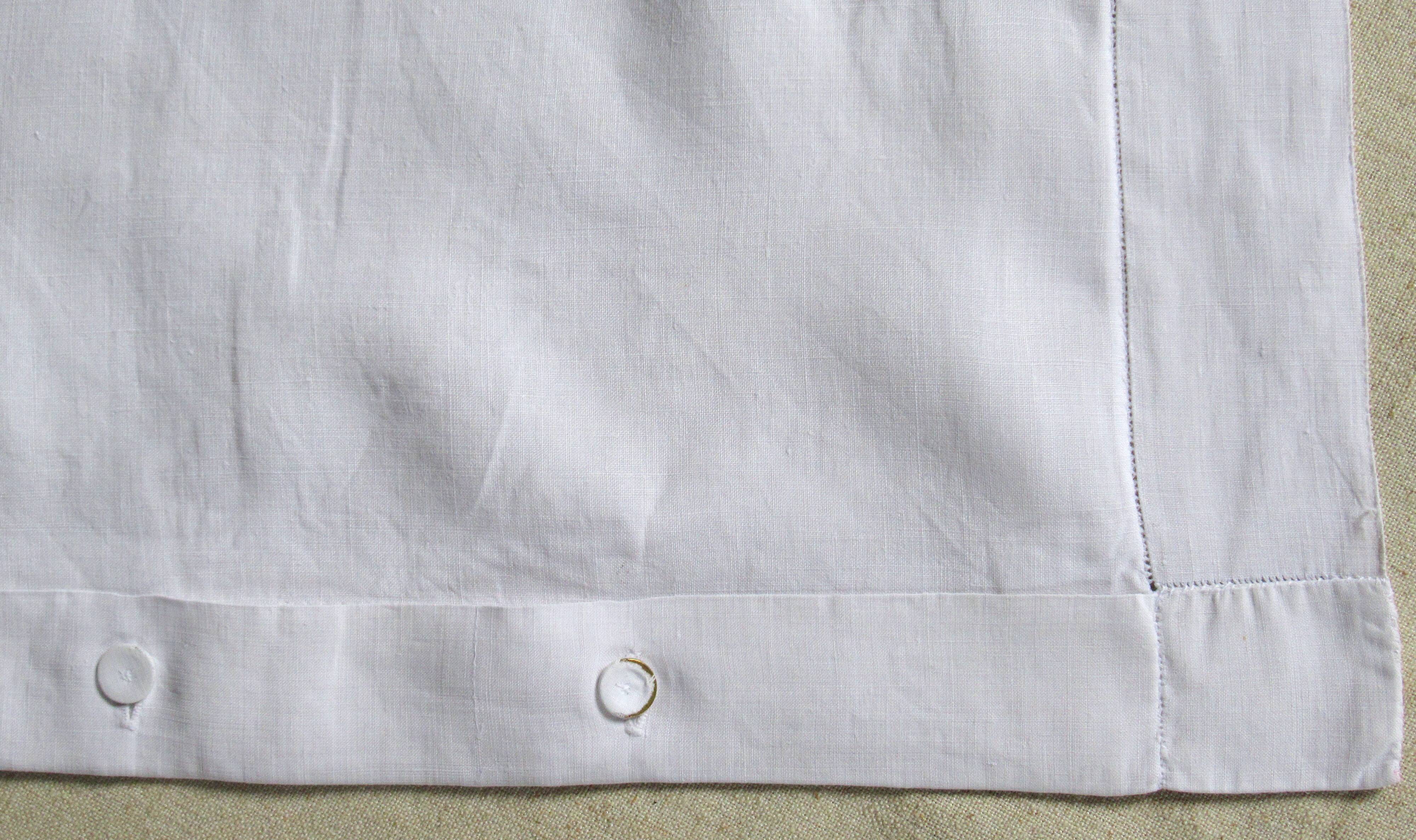 old pillowcase embroidered with fine flowers, marked MP, 19th