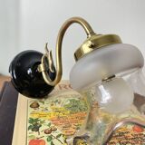 Swan neck wall light in brass with glass tulip.