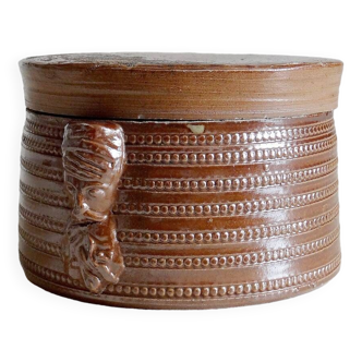 Stoneware pot with head handles