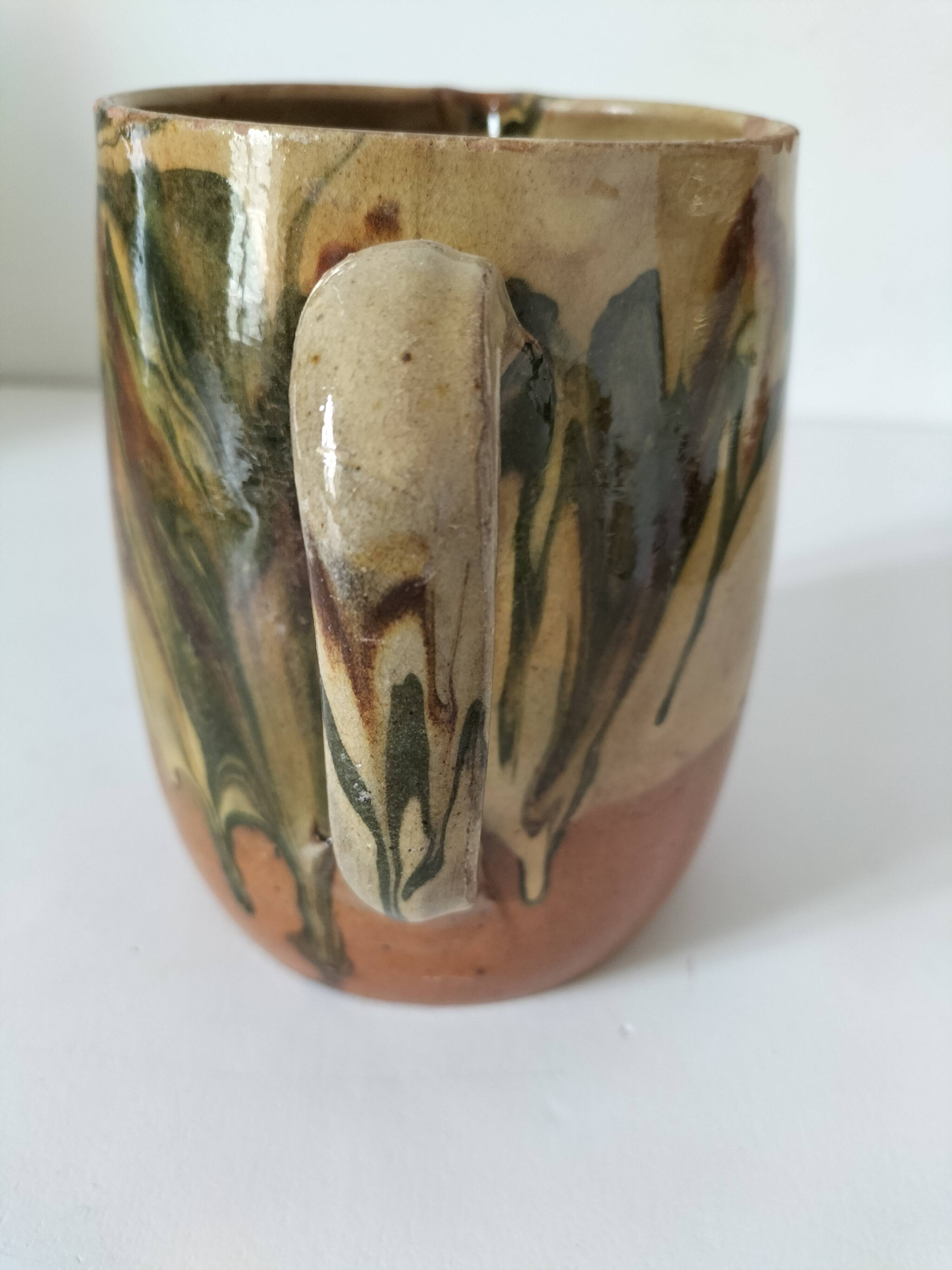 Glazed earthenware jug