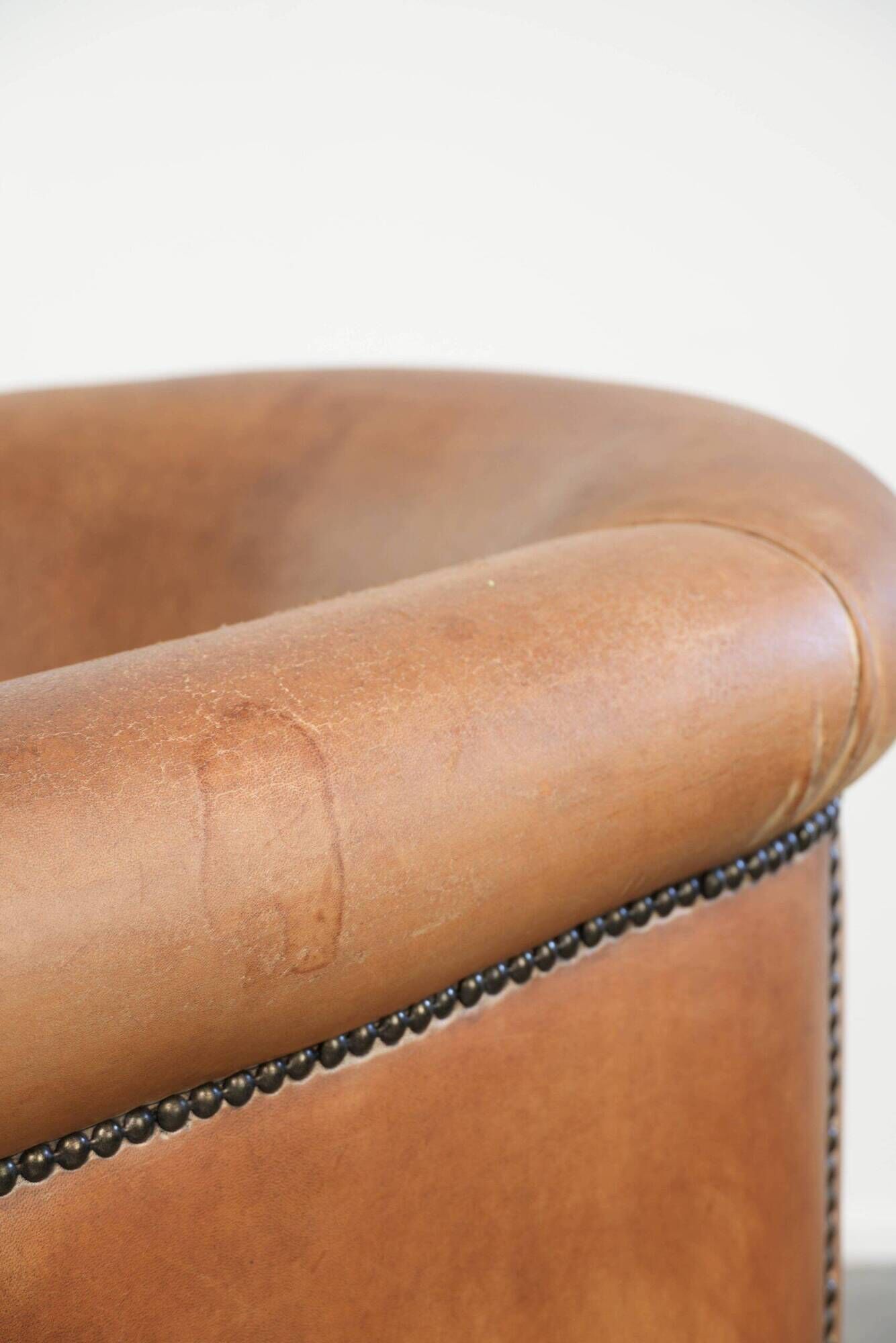 Vintage sheepskin club armchair in a beautiful light cognac colour