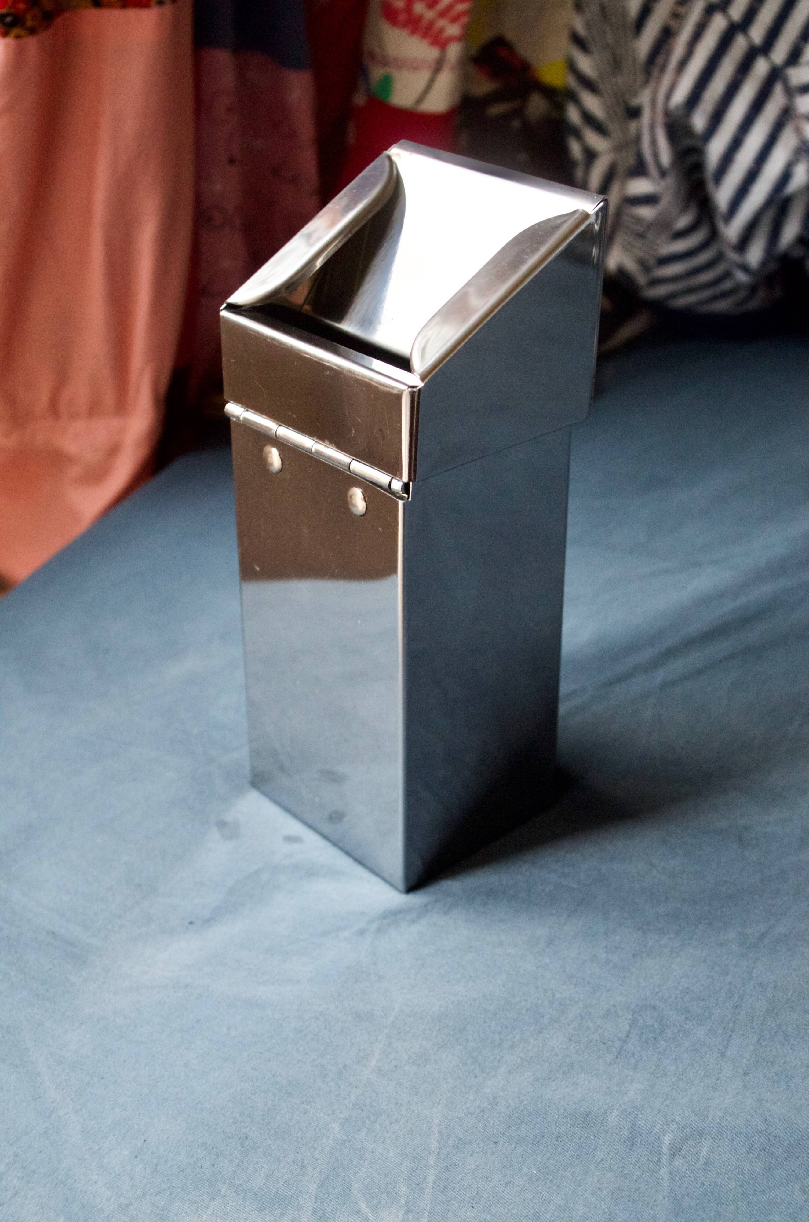 Vintage wall ashtray in shiny metal industrial style
