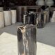 Black petrified wood side table with beige stripes, star pattern H35 D24.