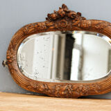 Beveled mirror in carved wood