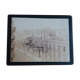 Old photograph from 1900 showing a Parisian warehouse with a carriage and horse.