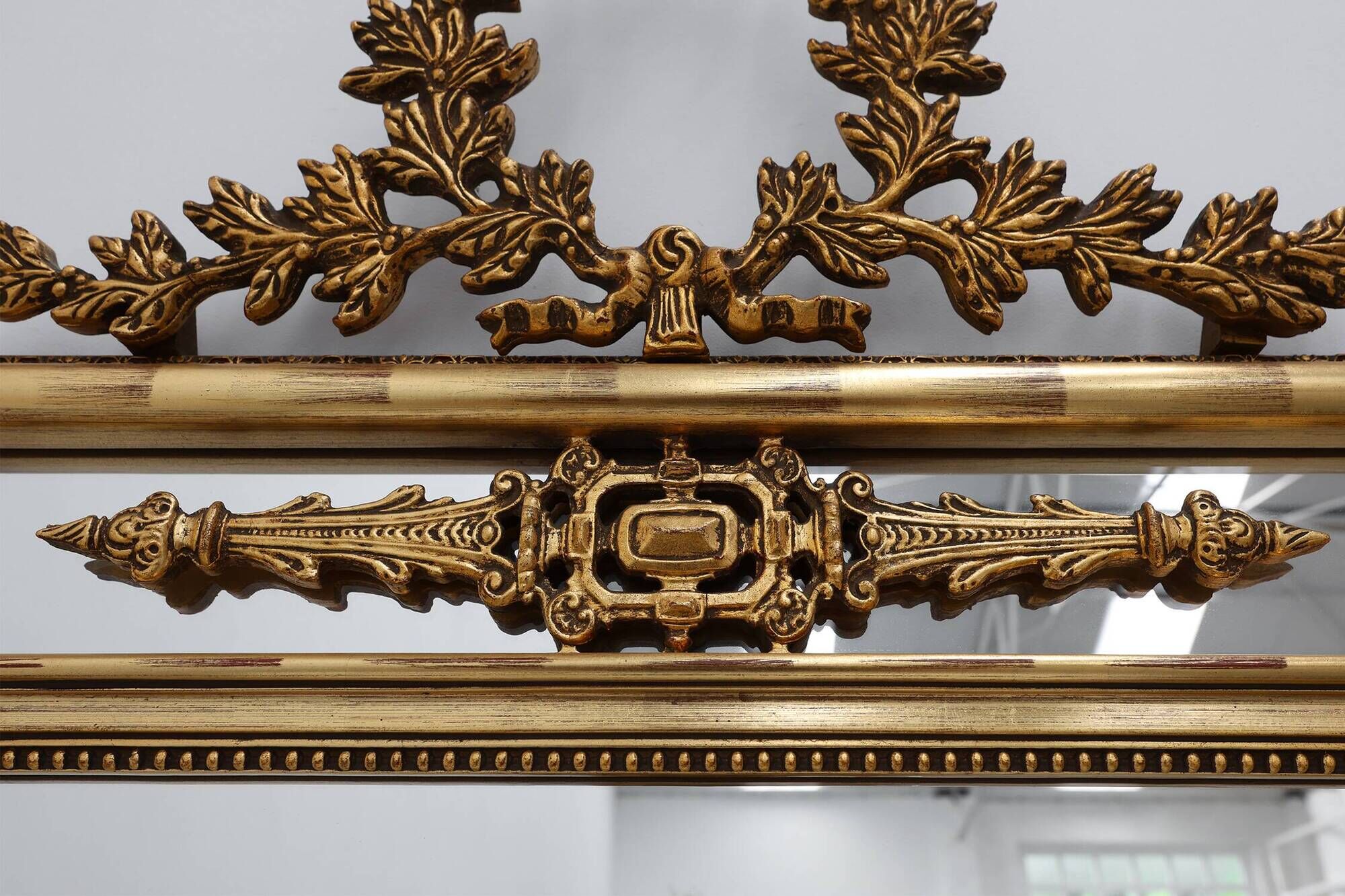 Louis XVI style gilt mirror with laurel wreath crest, Belgium, 20th century