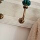 Wall-mounted coat rack in bleached wood and emerald green ceramic hooks –