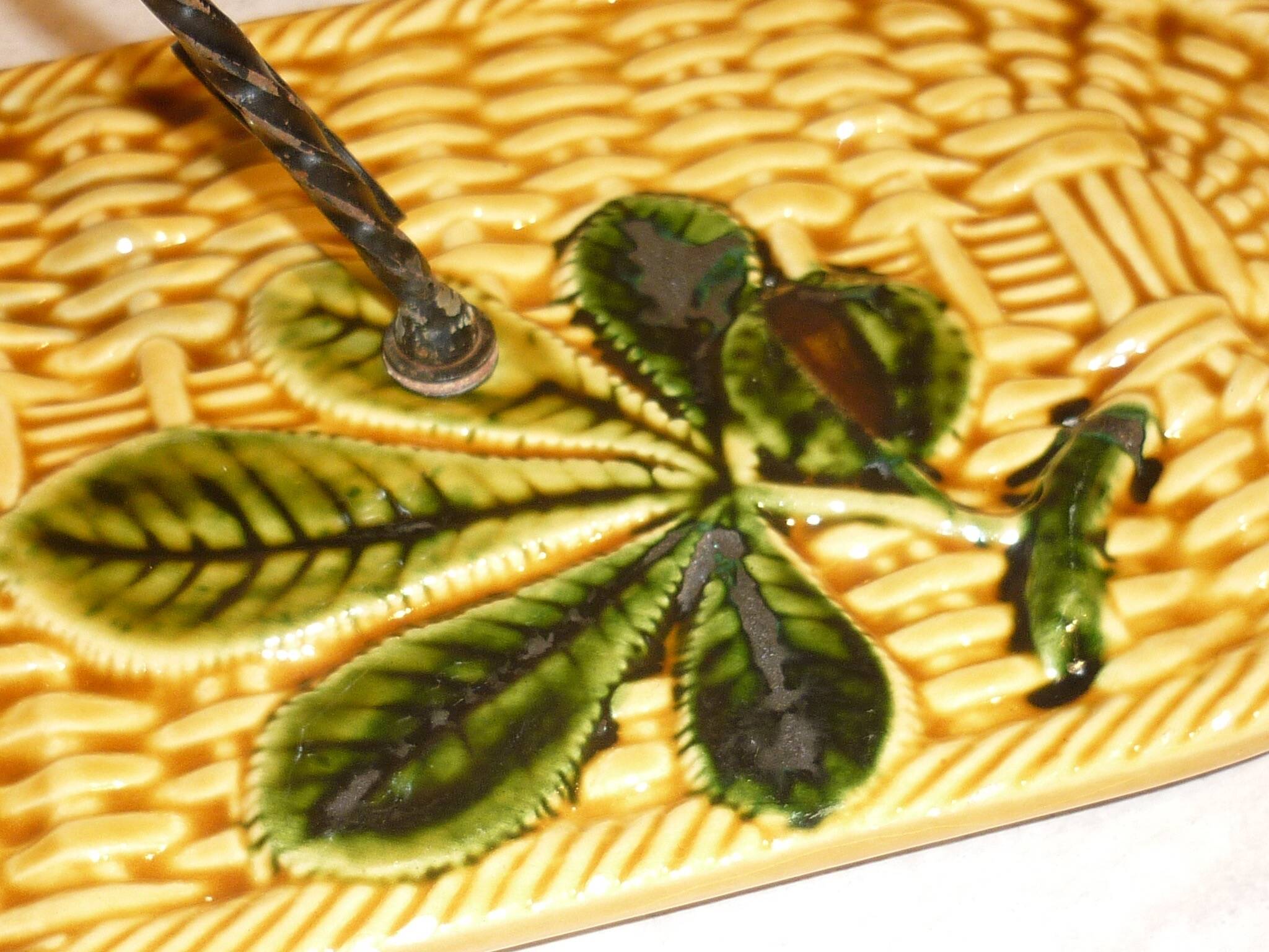 Braided yellow cheese platter and wrought iron