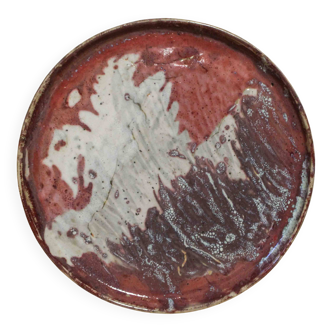 Large decorative plate in glazed stoneware, signed.