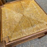 6 light solid wood chairs with high straw backs, farmhouse style.