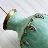Brass vase decorated with bunches of grapes.