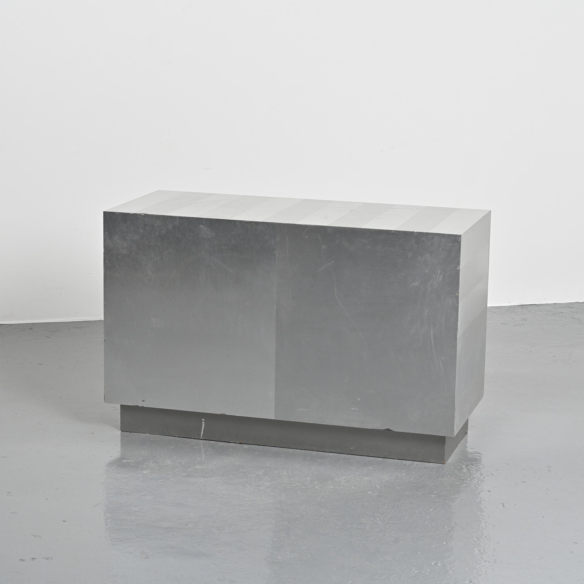 Pair of low buffets in brushed metal, French work, 1970s.